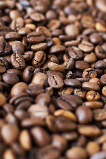 istock roasted aromatic coffee beans on a dark background 1351554221