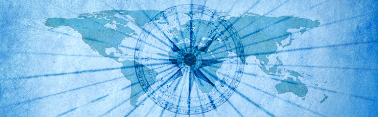 A compass rose on a map of the world with navigational lines radiating from the center of the compass. Map source material courtesy of https://images.nasa.gov/