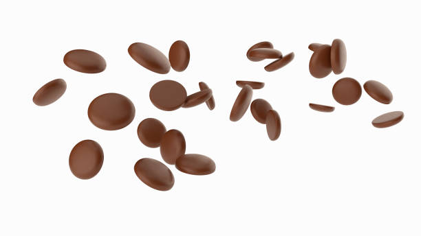 istock Delicious milk chocolate chips Flying falling 3d illustration 1351559397