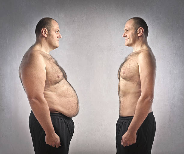 Diet Fat man standing in front of his fitter clone in front of stock pictures, royalty-free photos & images