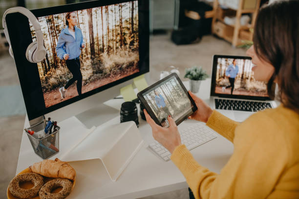 istock Photographer editing photos after shoot 1351569860