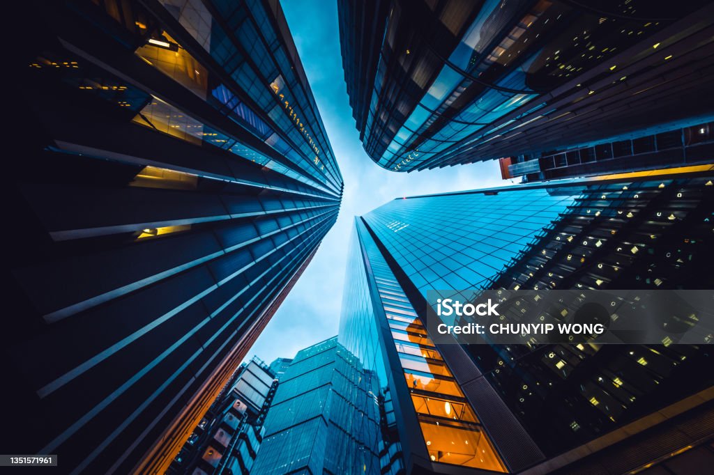 Looking directly up at the skyline of the financial district in central London Building Exterior Stock Photo