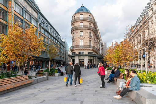 Street in front of Samaritaine department store in Paris, with color's autumn. Rue du Pont Neuf in Paris, France. November 2, 2021