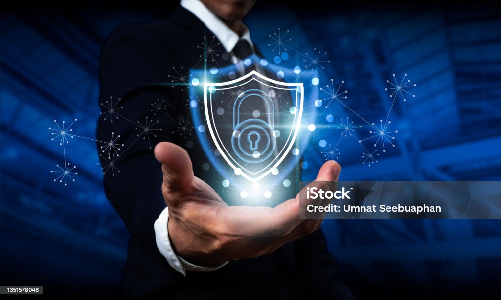 Businessman holding a shield with a padlock on a worldwide networking connection, Data protection and network security, insurance company, internet fire wall, and criminal cyber protection. Prevention Stock Photo