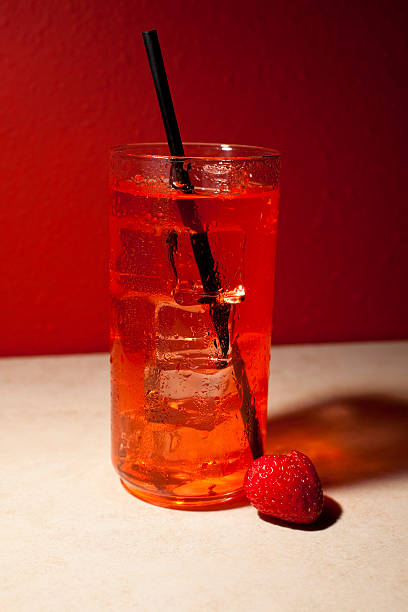istock Red drink with black straw and strawberry 135158028