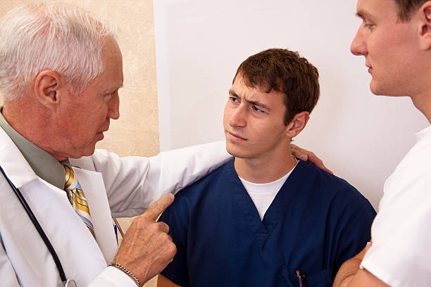istock Senior doctor mentoring young doctors 135158030