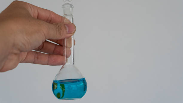 istock Hand holding glass tubes in the laboratory. Science, research and development concepts, test tubes with liquid chemicals in the laboratory. or scientific research and development ideas 1351583827