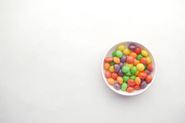 istock multi-colored sweet candies in a bowl on white background 1351590650