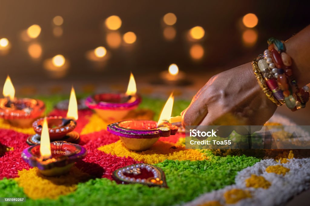 Traditional diya lamps lit during diwali celebration Diwali Stock Photo