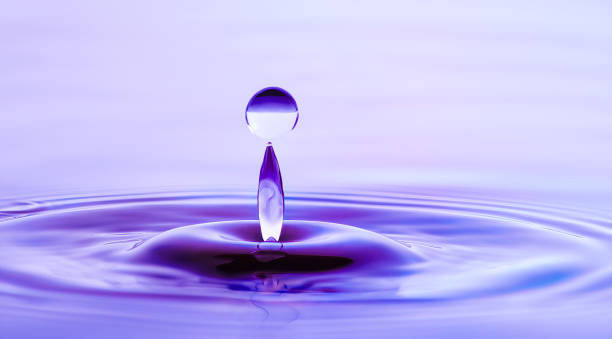 istock Water drop in shades of purple light 1351596463