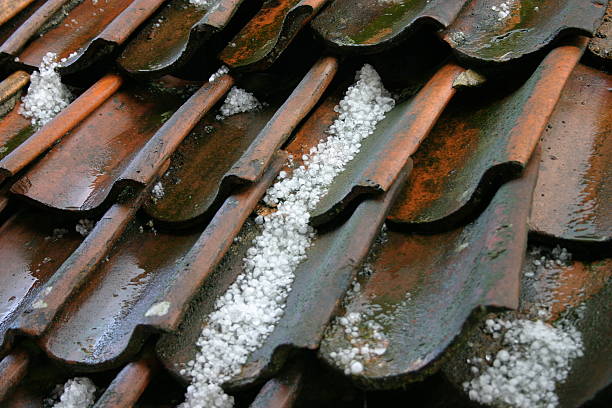 Hailstones on an old roof stock photo