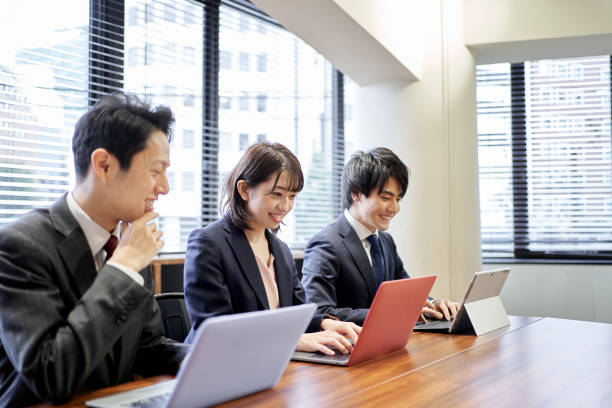 istock Asian business person working on a computer 1351599983