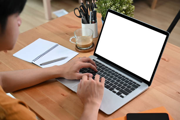 istock Young asian man working online with laptop computer. 1351600039