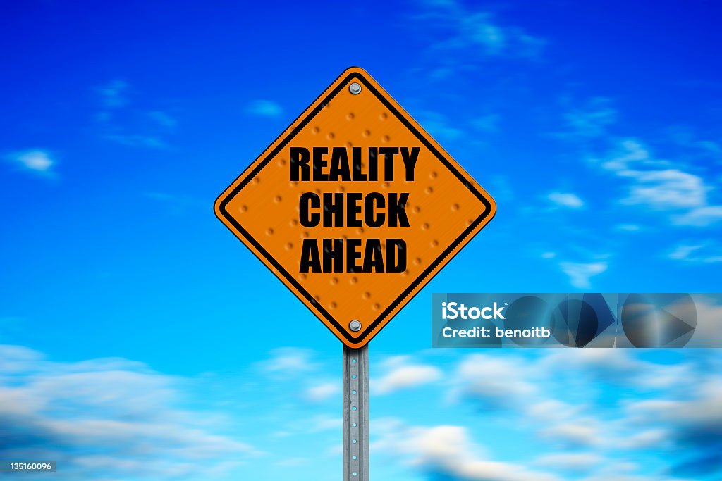 Street sign warning of reality check ahead Caution Reality Check Zone ahead... Blue Stock Photo
