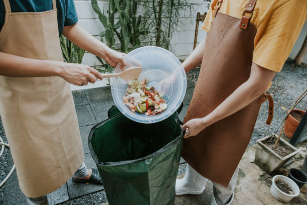 istock Eco friendly, Asian unrecognized people are composting kitchen waste-stock photo 1351601067