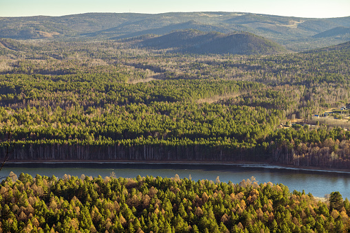 View of the Irkut river from the top of the mountain. Shamanskiy cliff.