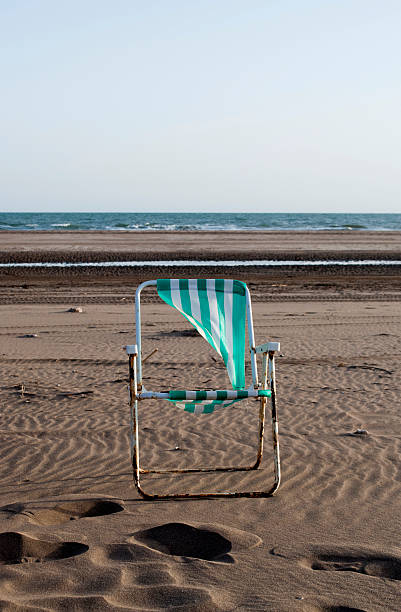 istock chair on the beach 135160265