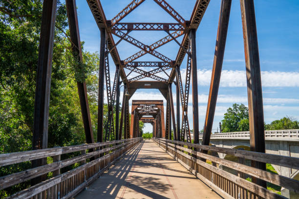istock Old iron rusty bridge over a Putah Creek in Winters CA. 1351606502