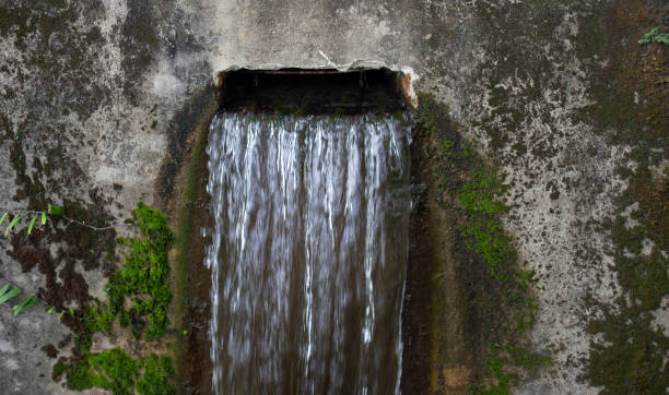 istock water flowing out of the drain 1351608513
