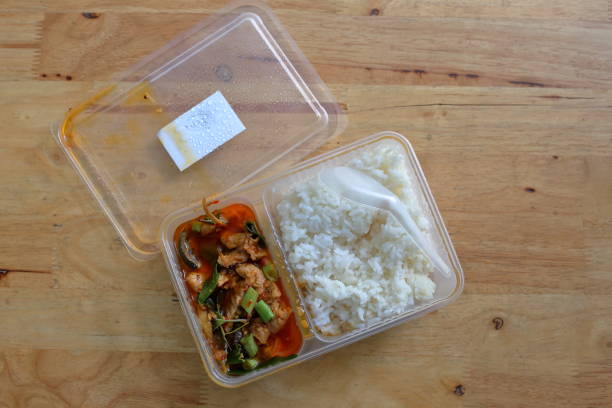 istock Stir-fried Pring with Pork Curry with Rice in a Box 1351610315