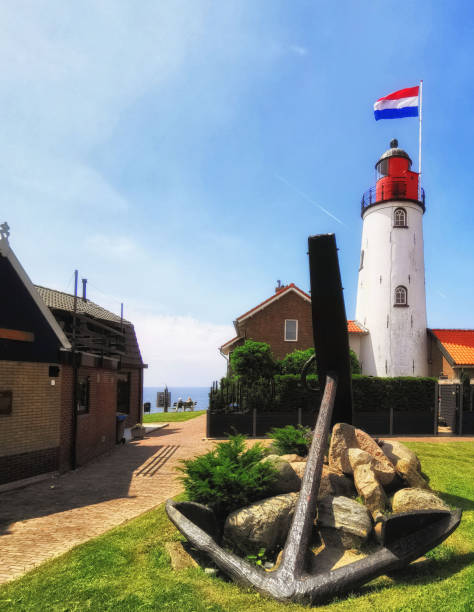 istock Lighthouse with Dutch flag Urk Netherlands 1351610956