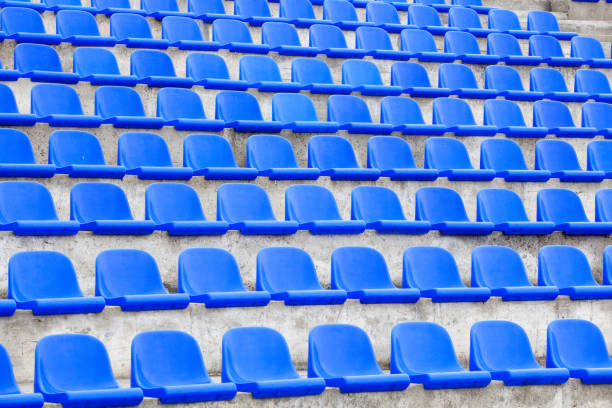 istock plastic blue seats on football stadium 1351611203