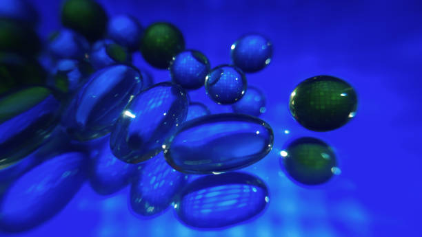 istock Abstract capsule balls on a glass surface on a colored blue blurred background 1351626355