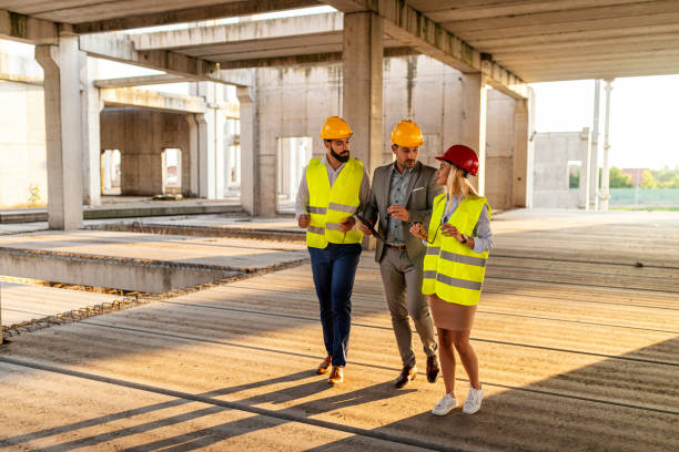 istock Construction manager explaining to the civil engineers the plans for construction works 1351626631