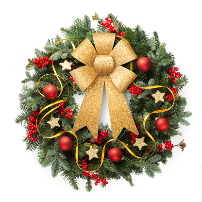 Christmas wreath with golden ribbon on white background.