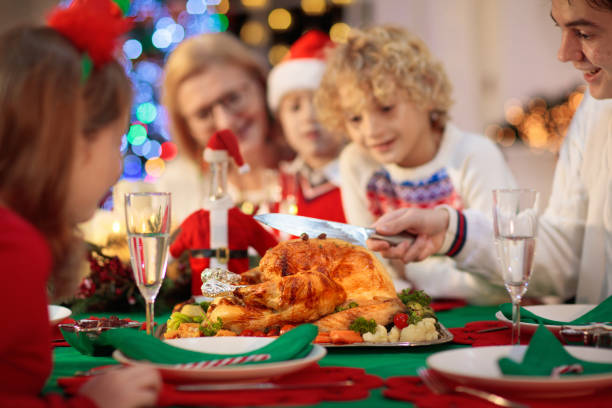 istock Christmas dinner. Family with kids at Xmas tree. 1351632165