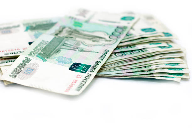 istock Scattered Russian 1000 rubles banknotes closeup isolated on the white 1351633243