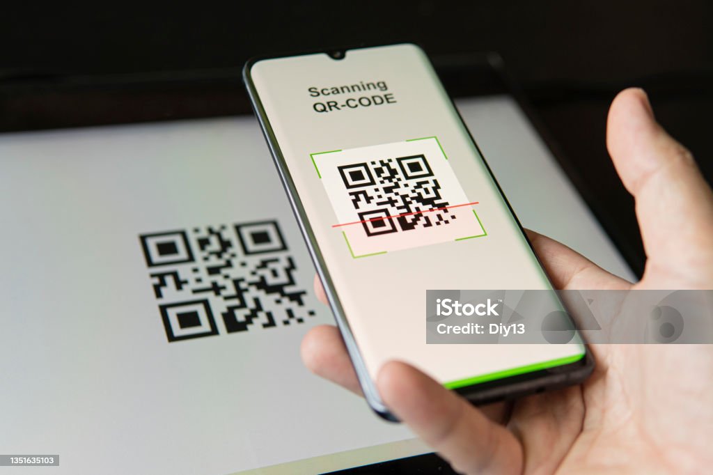 Scanning QR code with mobile smart phone. all graphics on the screen are made up. checking the qr code on the mobile phone. Scanning QR code with mobile smart phone. all the graphics on the screen are made up. checking the qr code on the mobile phone. QR Code Stock Photo