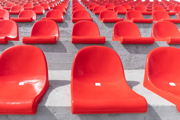 istock empty seats on the podium without people. Rows of red plastic stadium seats. 1351638176