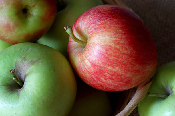 istock organic and fresh apples in a wicker basket 1351638556