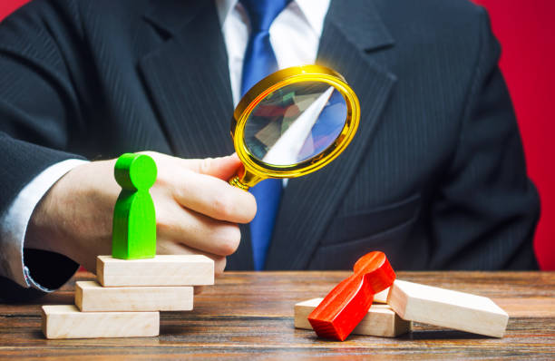 istock Man examines a defeated person. Analysis and work on mistakes. Weakness incompetence. Unprepared, unprofessional. Diplomacy, business. Struggle in competition, complete victory of a stronger opponent. 1351638592