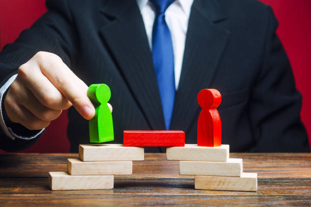 istock The man provides the conditions for negotiations and conflict resolution between opponents. Confrontation rivals. Build bridges, improve relationships. Arbitrator, mediator. Search for compromise. 1351638593