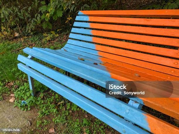 Isolated Multicolored Painted Park Bench Stock Photo - Download Image Now - Street Art, Creativity, Milan