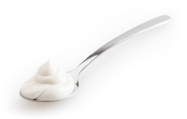 istock Spoon of mayonnaise isolated on white background with clipping path 1351646544