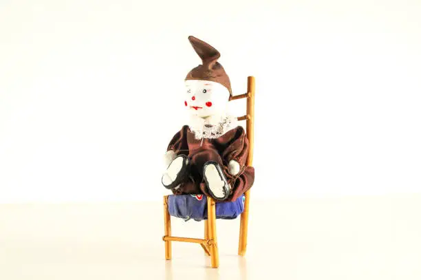 Photo of Pierrot toy doll on white background