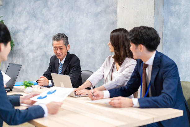istock Business persons having a meeting in office 1351648023