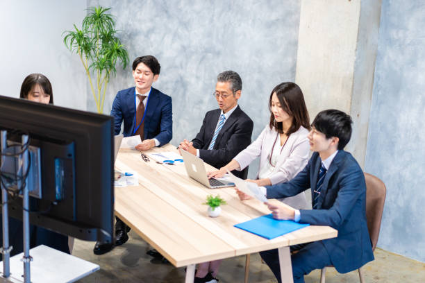 istock Business persons having a meeting in office 1351648034