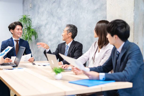 istock Business persons having a meeting in office 1351648036