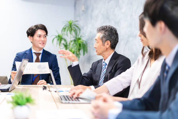 istock Business persons having a meeting in office 1351648038