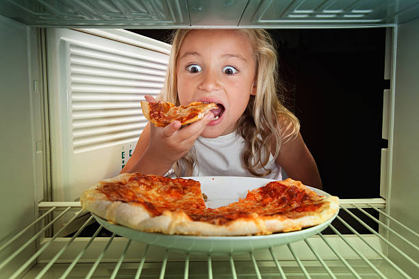 Little girl eat pizza