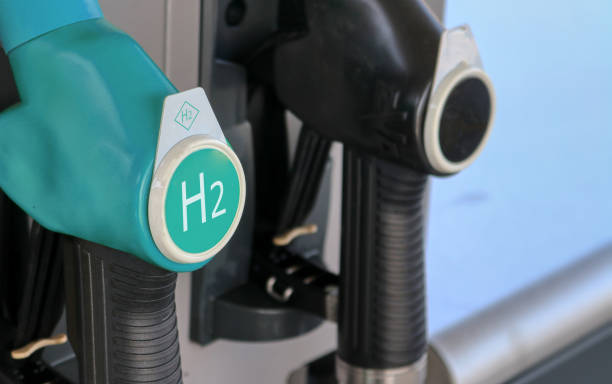 hydrogen logo on gas stations fuel dispenser. concept for emission free eco friendly transportation. green energy. fuel filler nozzle to fill hydrogen powered vehicles - hidrojen stok fotoğraflar ve resimler