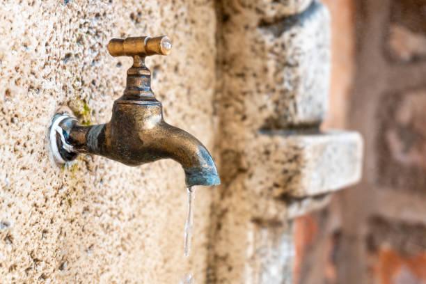 istock metal faucet dripping into a fountain 1351656255
