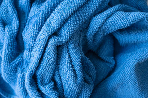 istock Crumpled terry, blue towel, top view. Background. 1351658560