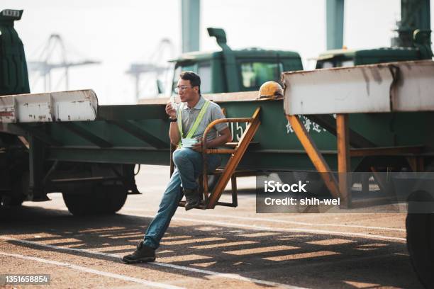 Dockers Enjoying Sandwiches Stock Photo - Download Image Now - Dock Worker, Shipyard, 40-44 Years
