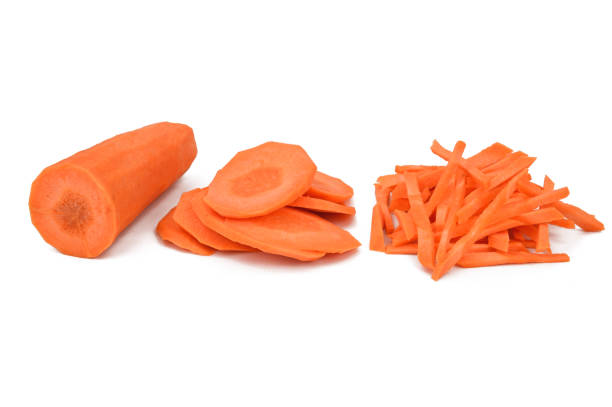 istock Half peeled carrots, carrots cut into slices and carrots cut into strips 1351662062
