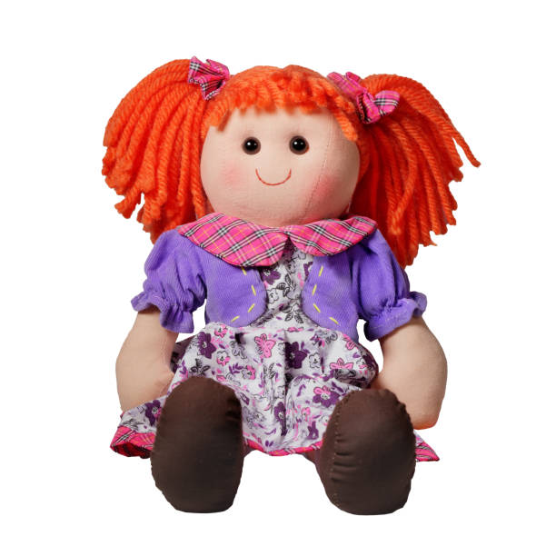 istock Curly cute rag doll toy smile and sit isolated on white studio shot 1351665907